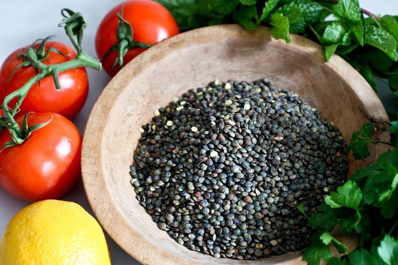 This Simple Lentil Tabouli Salad is full of Middle Eastern flavor! Filling lentils are paired with summer  tomatoes, lemon, mint and parsley and a unique combination of spices, and keeps for several days, perfect for midweek lunches or potlucks! Vegan and Gluten-Free #tabouli #lentil #lentils #lentilsalad #lentiltabouli #lentiltabbouleh #tabbouleh #vegan #salad #glutenfree