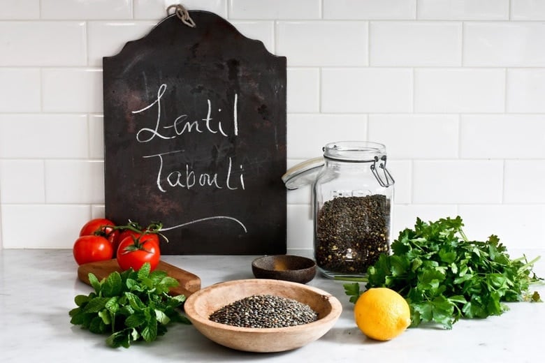 This Simple Lentil Tabouli Salad is full of Middle Eastern flavor! Filling lentils are paired with summer  tomatoes, lemon, mint and parsley and a unique combination of spices, and keeps for several days, perfect for midweek lunches or potlucks! Vegan and Gluten-Free #tabouli #lentil #lentils #lentilsalad #lentiltabouli #lentiltabbouleh #tabbouleh #vegan #salad #glutenfree