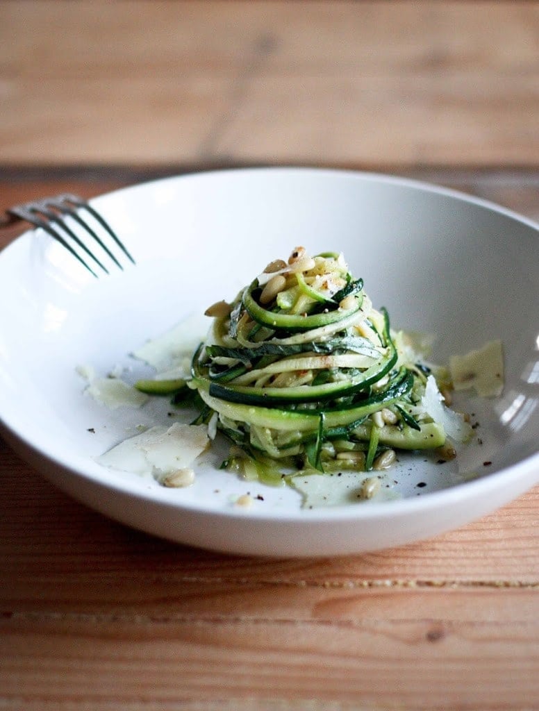 Zucchini Linguine with garlic, olive oil, toasted pine nuts, basil ribbons & shaved pecorino cheese, a simple delicious GF meal,made w/ Zucchini "noodles"! | www.feastingathome.com