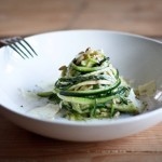 Zucchini Linguine with garlic, olive oil, toasted pine nuts, basil ribbons & shaved pecorino cheese, a simple delicious GF meal,made w/ Zucchini "noodles"! | www.feastingathome.com #zoodles #zucchininoodles #lowcarb #zucchini #spiralized