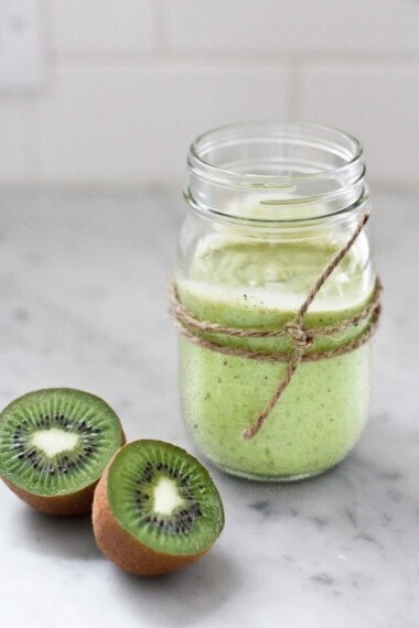 This Kiwi Smoothie is sure to brighten your day!  Made with banana, avocado, and spinach, it's sweet and tart, and deliciously addicting. Vegan!
