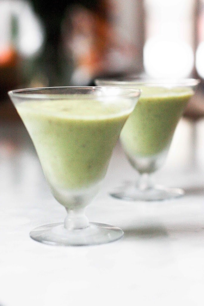 A simple tasty recipe for Avocado Smoothie with Kiwi and lime, sweetened with honey ( or maple). Deliciously addicting and easy to make! | www.feastingathome.com