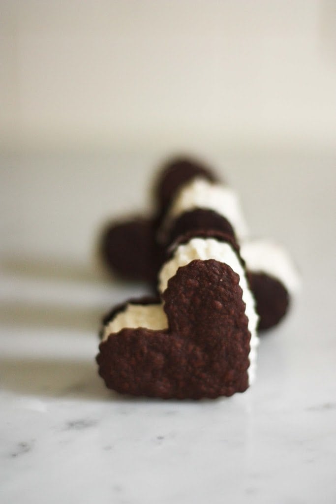 Heart shaped ice cream sandwiches with a bittersweet double chocolate cookie...make an easy valentine treat. #icecreamsandwich #valentines #icecream 