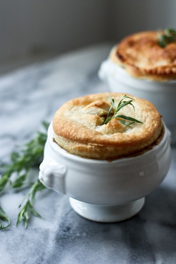 Vegan Pot Pie with Spring Veggies! A simple delicious pot pie recipe made with flakey puff pastry crust that features vibrant spring veggies. Simple, easy and full of flavor! #potpie #vegan #veganpotpie