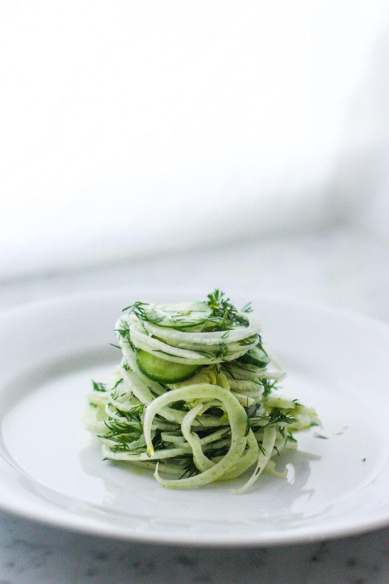 Simple, delicious Fennel Salad with cucumber and fresh Dill. Refreshing and light, this vegan salad can be made ahead, and pairs with so many things! #fennelsalad #fennel #vegansalad #plantbased #fennelslaw