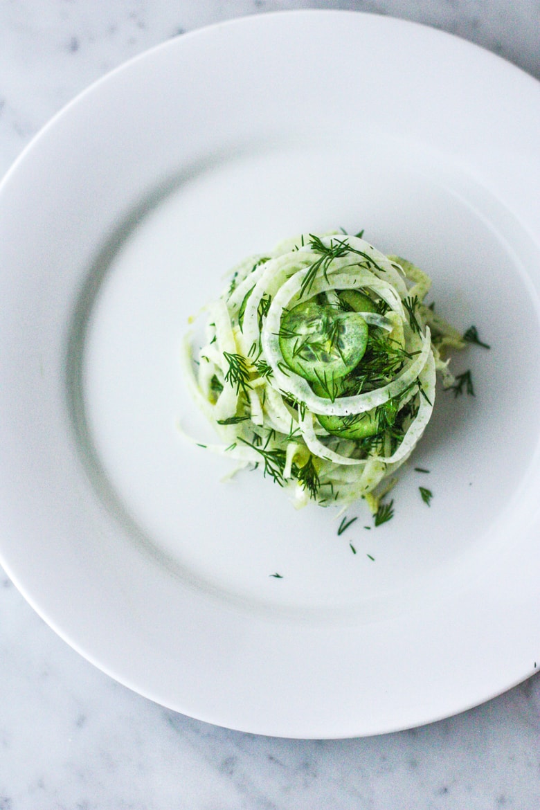 Simple, delicious Fennel Salad with cucumber and fresh Dill. Refreshing and light, this vegan salad can be made ahead, and pairs with so many things! #fennelsalad #fennel #vegansalad #plantbased #fennelslaw