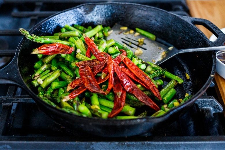 adding dired chilies to the pan