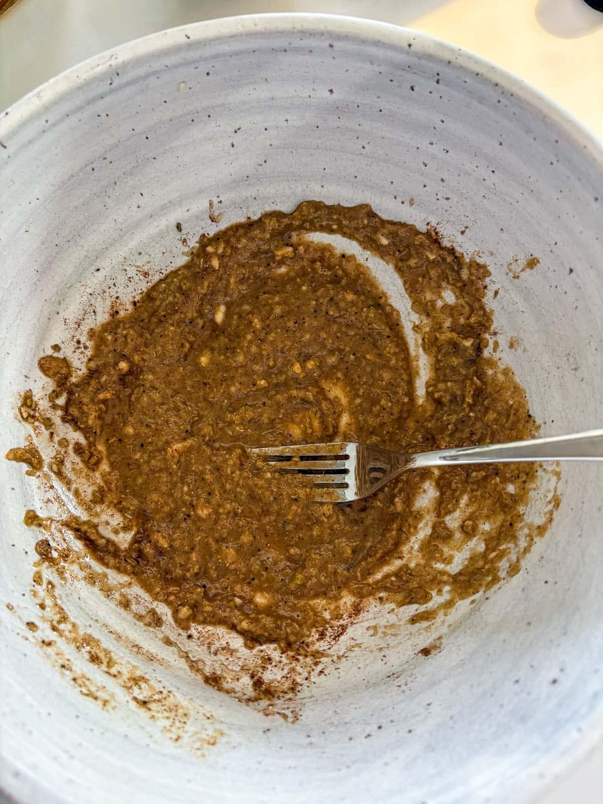 bowl with lemongrass marinade and a fork.