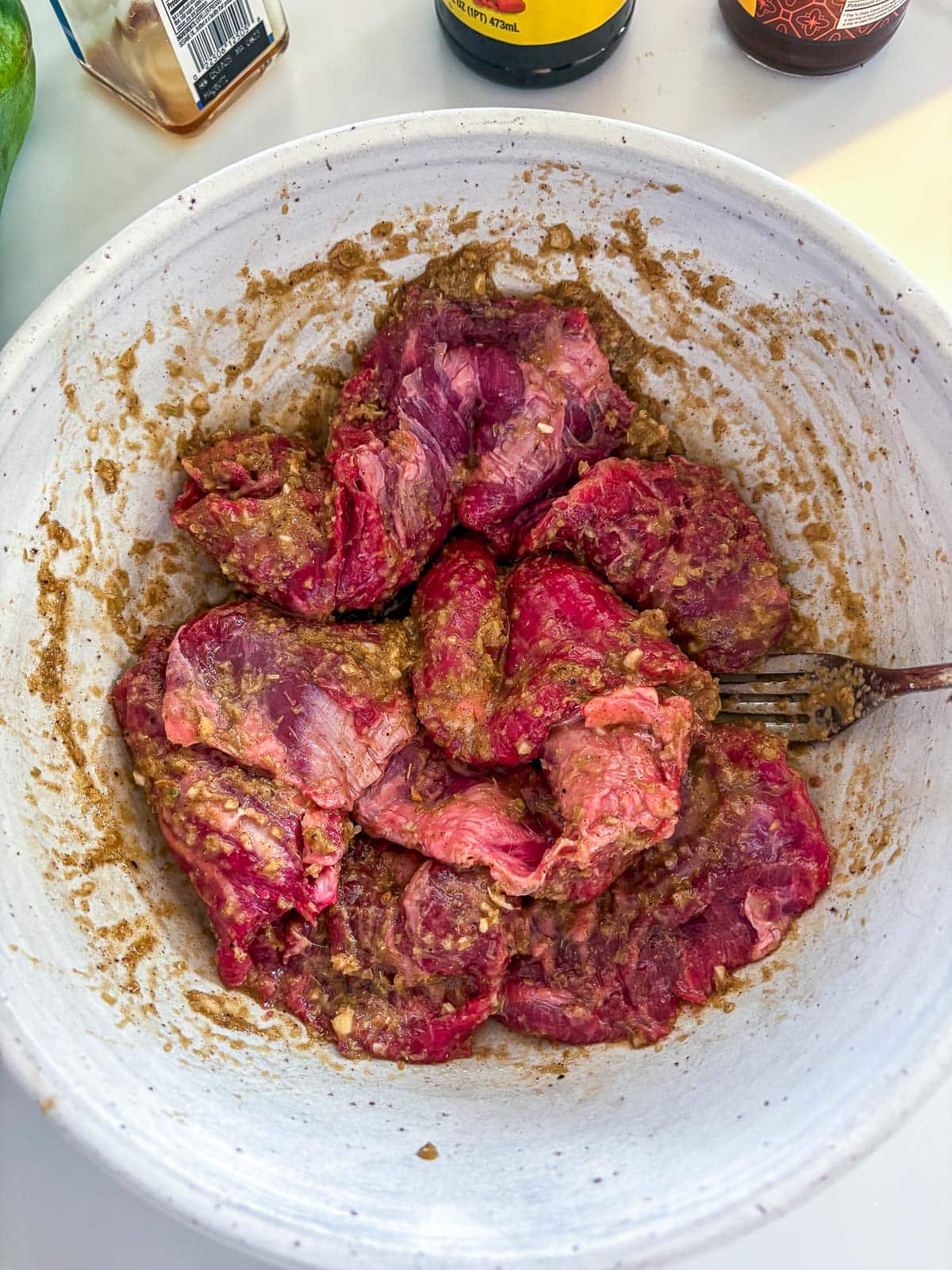 marinated beef in a bowl.
