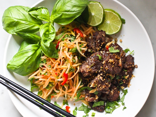 A simple delicious recipe for Vietnamese Beef with Green Papaya Salad- full for flavor this recipe is one of my favorites! | www.feastingathome.com
