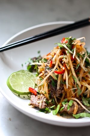 A simple delicious recipe for Vietnamese Beef with Green Papaya Salad- full for flavor this recipe is one of my favorites! | www.feastingathome.com