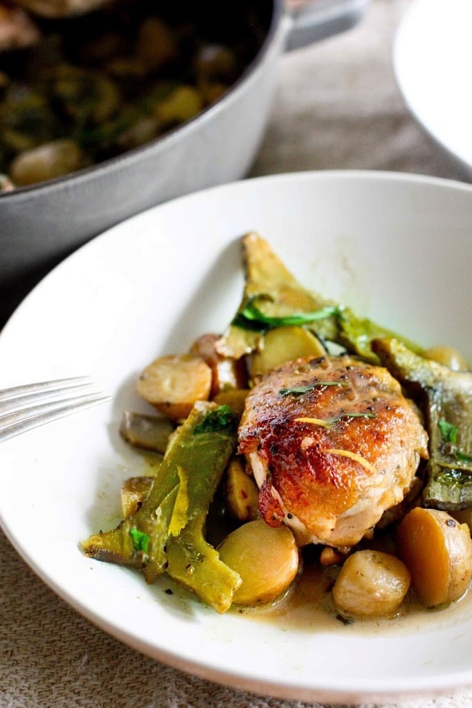 Braised Crispy Chicken Thighs with Artichoke hearts, leeks, potatoes and tarragon- a delicious one-pan recipe perfect for spring! 