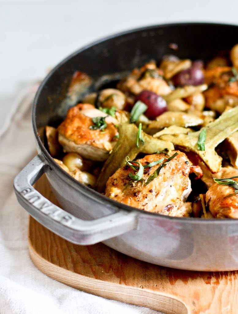 Braised Crispy Chicken Thighs with Artichoke hearts, leeks, potatoes and tarragon- a delicious one-pan recipe perfect for spring!