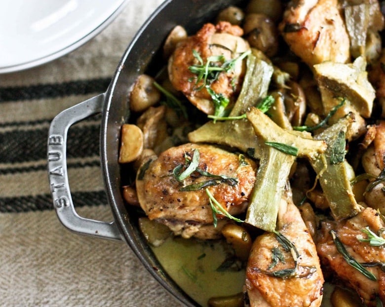 Braised Crispy Chicken Thighs with Artichoke hearts, leeks, potatoes and tarragon- a delicious one-pan recipe perfect for spring!