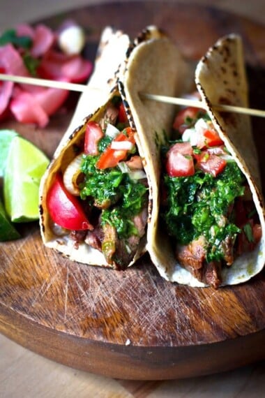 The Best Grilled Steak Taco Recipe with Chimichurri Sauce, Pico De Gallo, and pickled onions.