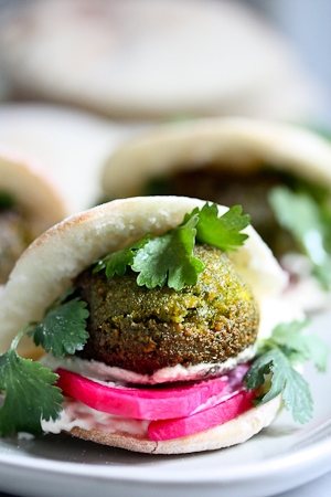 40 Mouthwatering Vegan Dinner Recipes!| Falafels with Tahini Sauce. This authentic recipe is made with soaked, uncooked chickpeas and hands-down has the BEST texture and flavor! So easy! Bake them or pan-sear them. Great in wraps, bowls, or salads. | #falafel #falafels #falafelrecipe #falafelsalad, #bowl #veganfalafelrecipe #bakedfalafel #vegan #easyfalafel
