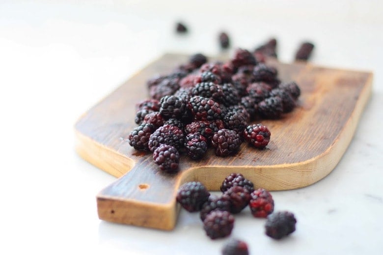 Blackberry Sourdough Scones with Lemony Glaze- plus a little baking tip to help keep blackberries in tact! | www.feastingathome.com