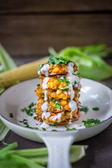 Celebrate the bounty of summer with these fresh corn fritters! A flavorful recipe that works as a tasty appetizer, hearty side dish, or a vegetarian main course. Serve with Cilantro Lime Crema.