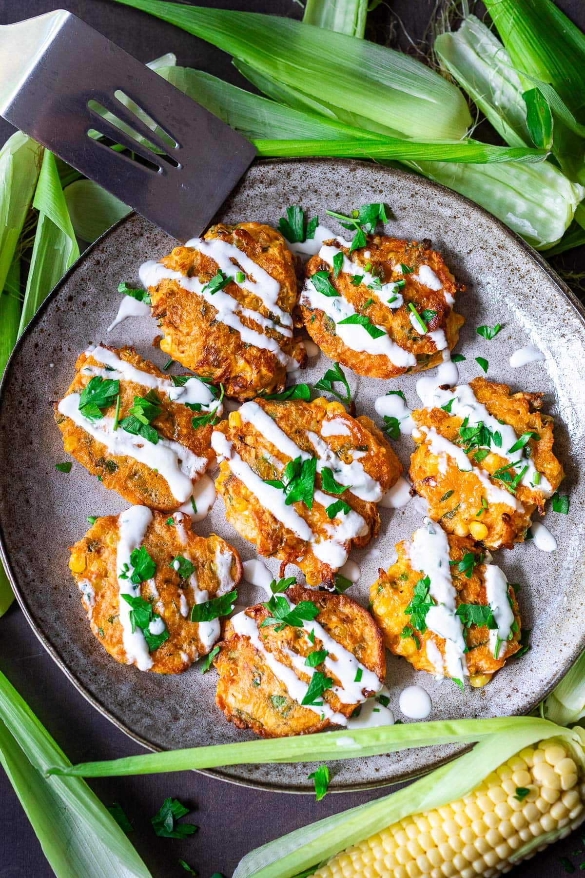 Celebrate summer with fresh Corn Fritters with creamy Cilantro Dipping Sauce. A tasty appetizer, hearty side dish, or vegetarian main dish.