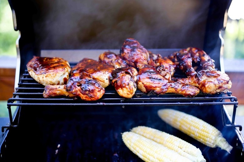 Smokey, Sweet, Spicy and tangy, this Grilled BBQ Chicken is mouthwatering! The Chipotle BBQ sauce is made form scratch....so tasty! | #bbqchicken #bbqchickenrecipe #chipotlechicken | www.feastingathome.com
