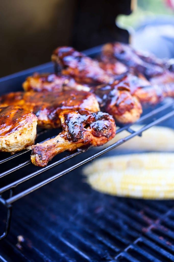 Smokey, Sweet, Spicy and tangy, this grilled BBQ Chicken is mouthwatering! The Chipotle BBQ sauce is made form scratch....so tasty! | #bbqchicken #bbqchickenrecipe #chipotlechicken | www.feastingathome.com