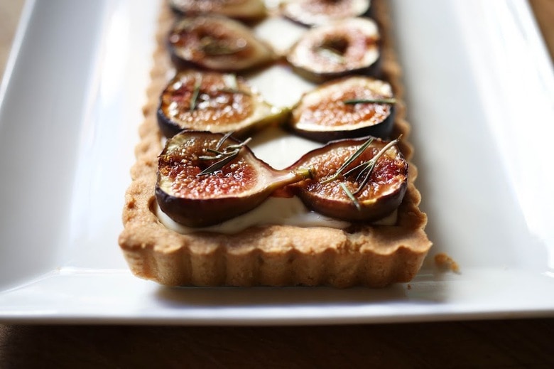 Delicious recipe for Roasted Fig Tart with Honey, Goat cheese and Mascarpone....using fresh figs, lightly roasted and caramelized in the oven. | www.feastingathome.com