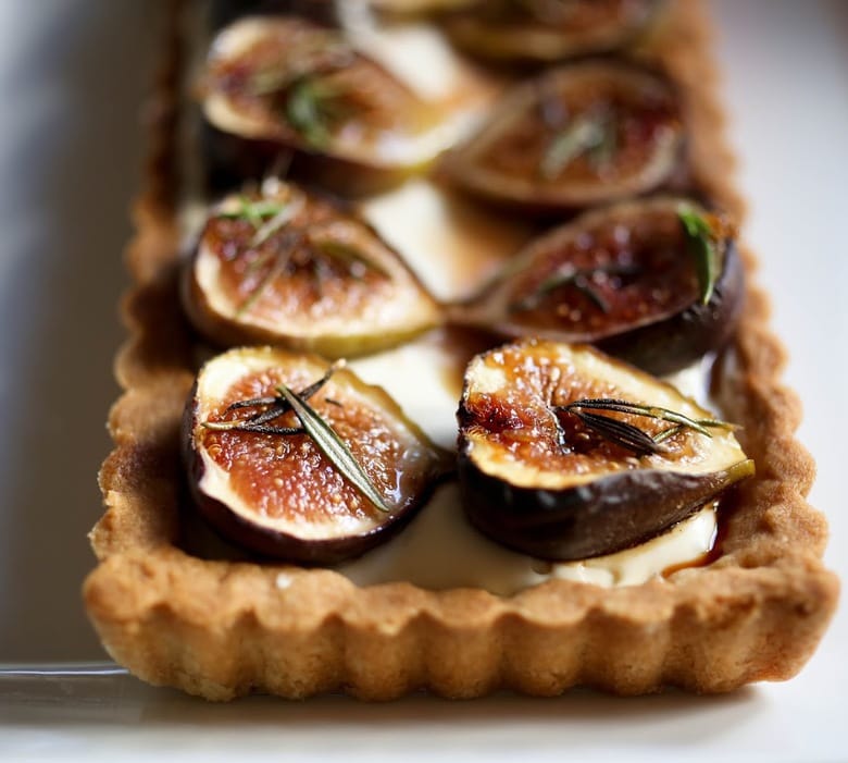 Delicious recipe for Roasted Fig Tart with Honey, Goat cheese and Mascarpone....using fresh figs, lightly roasted and caramelized in the oven. | www.feastingathome.com