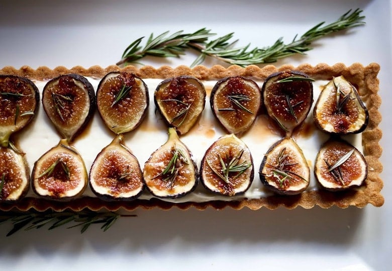 Delicious recipe for Roasted Fig Tart with Honey, Goat cheese and Mascarpone....using fresh figs, lightly roasted and caramelized in the oven. | www.feastingathome.com