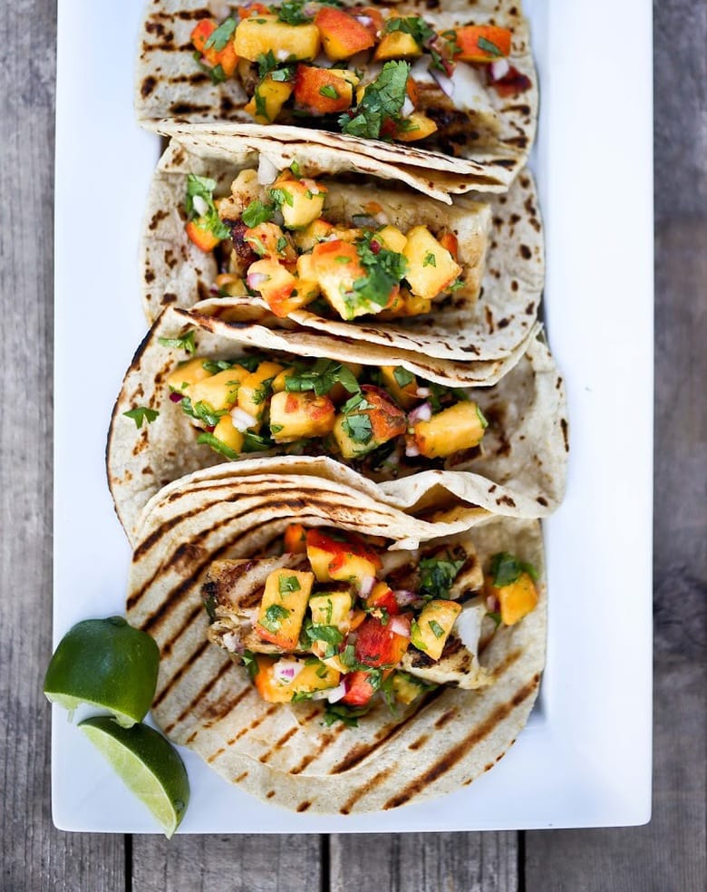 Grilled Chipotle Fish Tacos with fresh Peach Habanero Salsa. Delicious summertime flavor! | www.feastingathome.com