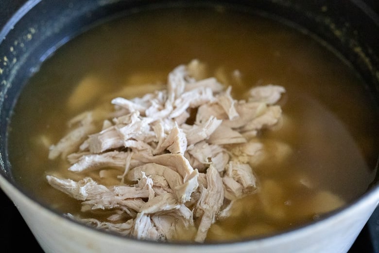 shredded chicken breast in the broth