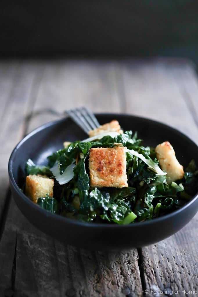 A simple healthy recipe for Kale Caesar Salad with Millet Croutons. The croutons are gluten free and fun to make! | www.feastingathome.com