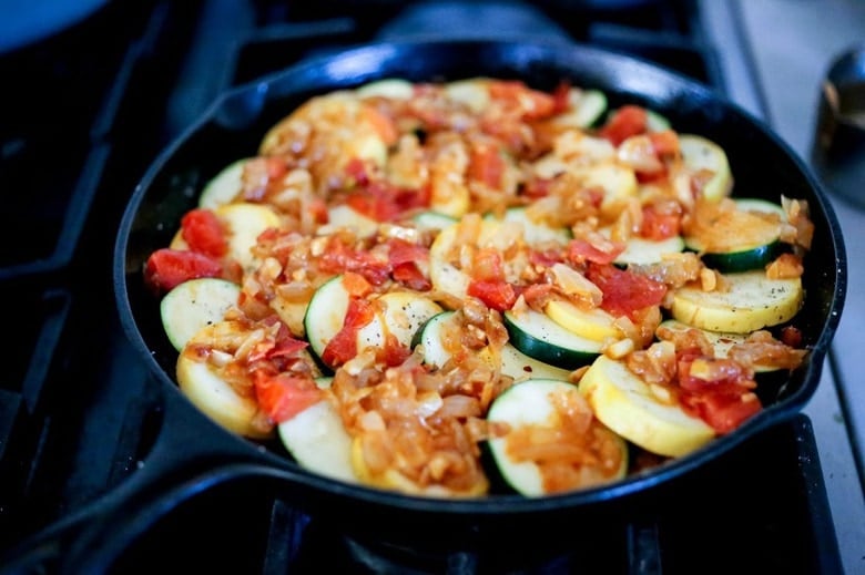 Baked Zucchini Tian with Middle Eastern Spices served over rice for simple vegetarian meal, or as a delicious side dish. Healthy and Vegan! #bakedzucchini #vegan #zucchini #zucchinitian #zucchinirecipes