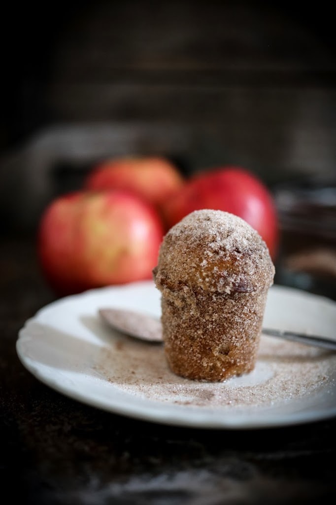 Apple Brown Butter Bouchons (aka Donut Muffins! ) are very easy to make and oh so delicious! Baked instead of fried, they are rolled in browned butter and sprinkled with cinnamon-sugar. #donutmuffins