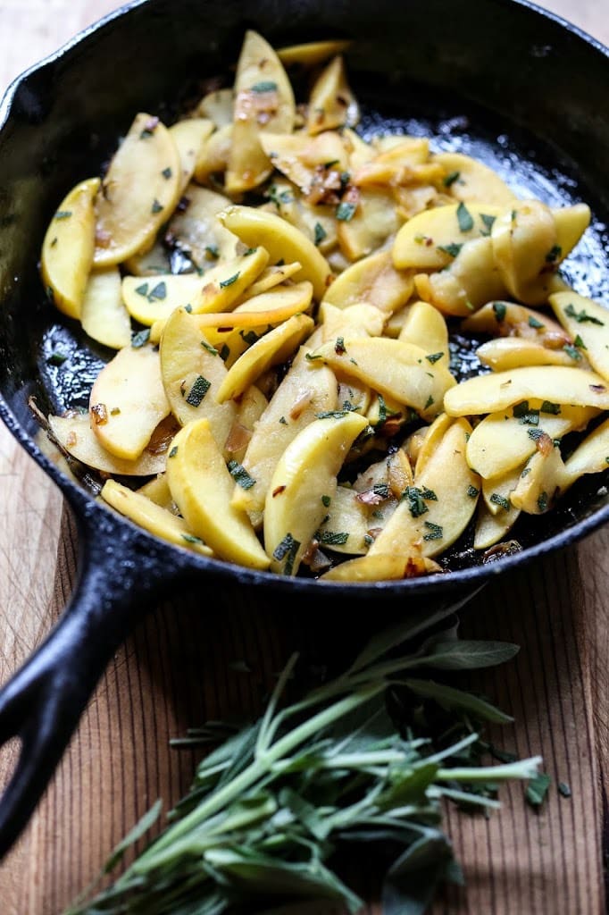 Grilled Pork with Hard Cider Pan Sauce, sautéed apples and sage. A delicious meal, perfect for fall. | www.feastingathome.com