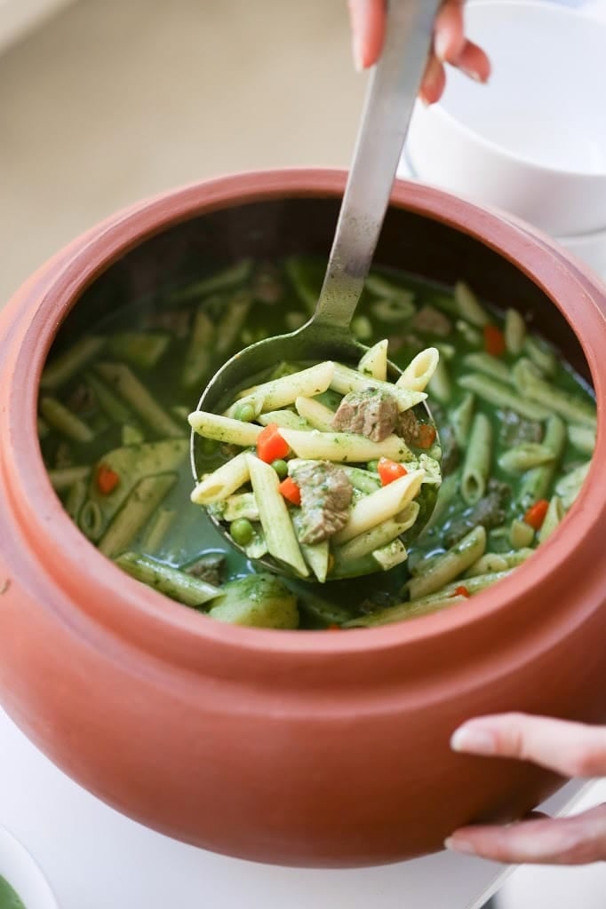 A delicious recipe for Peruvian Minestrone Soup - made with a fragrant basil broth. Healthy and flavorful! www.feastingathome.com