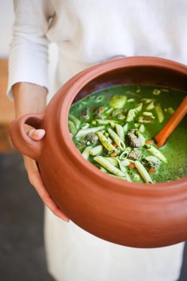 A delicious recipe for Peruvian Minestrone Soup - made with a fragrant basil broth. Healthy and flavorful! www.feastingathome.com