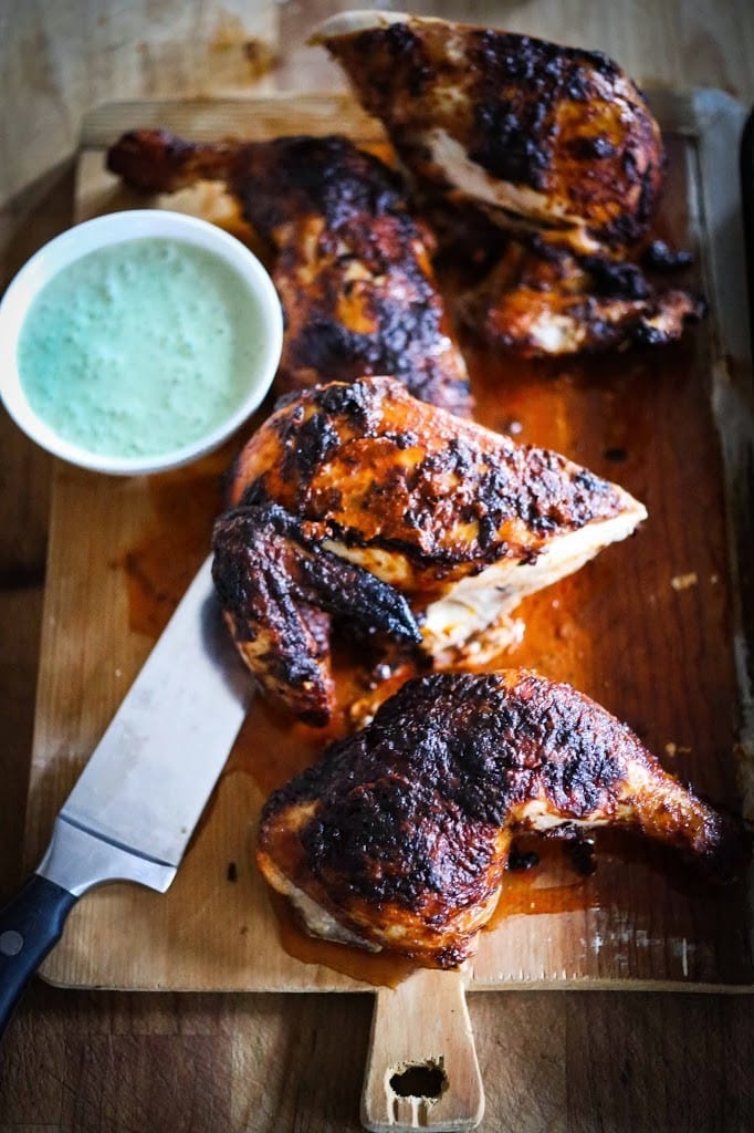 Peri Peri Chicken, baked on a sheet pan over crispy potatoes. 