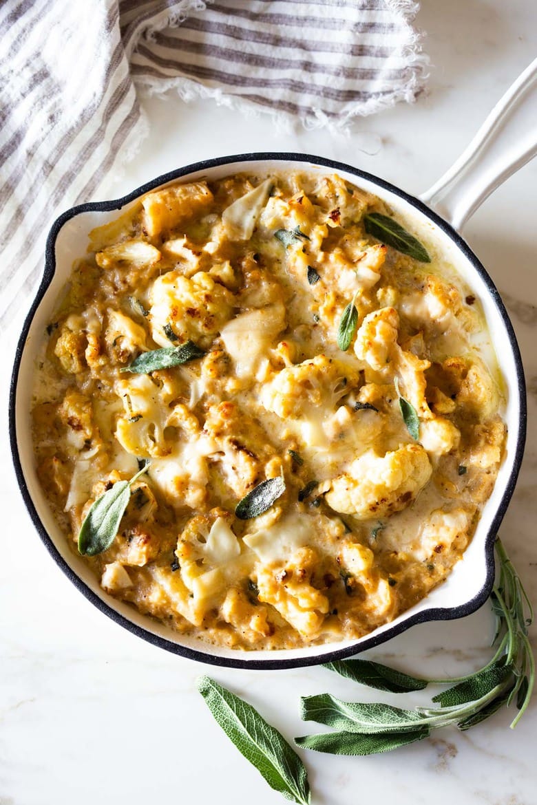 Roasted Cauliflower Gratin with garlic and sage, a delicious vegetarian side dish that is keto, low carb and gluten-free- adaptable, perfect for the holiday table! #cauliflower #cauliflowergratin #lowcarbside #sidedish #lowcarb #keto #thanksgivingside #christmassidedish