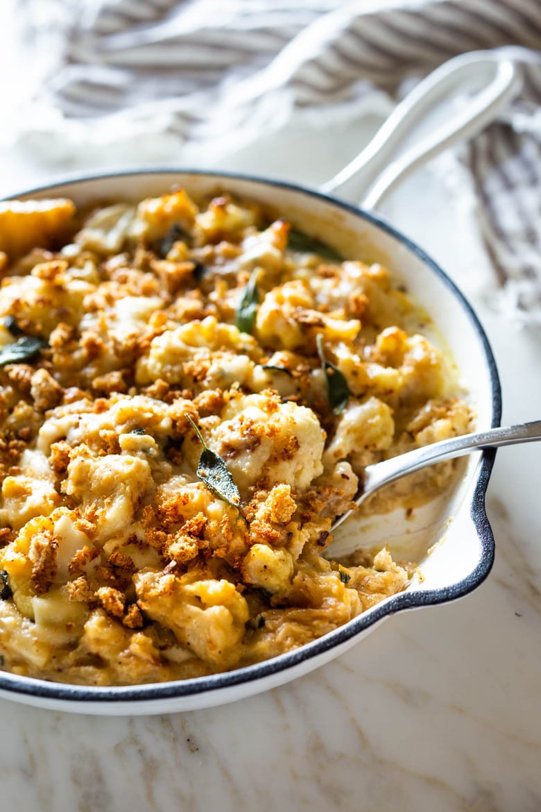 Roasted Cauliflower Gratin with garlic and sage, a delicious vegetarian side dish that is keto, low carb and gluten-free- adaptable, perfect for the holiday table! #cauliflower #cauliflowergratin #lowcarbside #sidedish #lowcarb #keto #thanksgivingside #christmassidedish