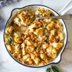 Roasted Cauliflower Gratin with garlic and sage, a delicious vegetarian side dish that is keto, low carb and gluten-free- adaptable, perfect for the holiday table! #cauliflower #cauliflowergratin #lowcarbside #sidedish #lowcarb #keto #thanksgivingside #christmassidedish
