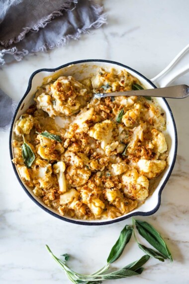 Roasted Cauliflower Gratin with garlic and sage, a delicious vegetarian side dish that is keto, low carb and gluten-free- adaptable, perfect for the holiday table! #cauliflower #cauliflowergratin #lowcarbside #sidedish #lowcarb #keto #thanksgivingside #christmassidedish