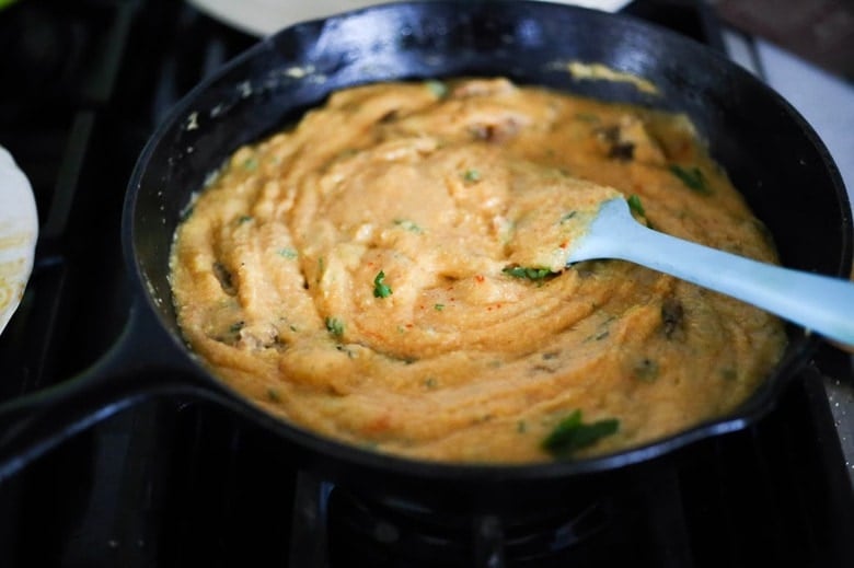 Creamy Polenta with poached eggs, chorizo and cilantro- a flavorful hearty brunch! #polenta #eggs #chorizo #brunch #breakfast #brunchrecipes #polentaeggs 