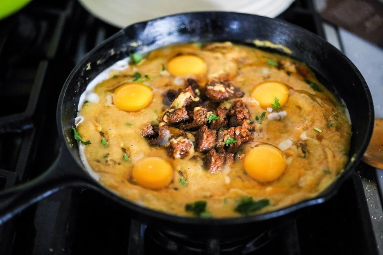 Creamy Polenta with poached eggs, spicy chorizo and cilantro- a delicious hearty brunch that is full of flavor! Feel free to use vegan chorizo or turkey chorizo! 