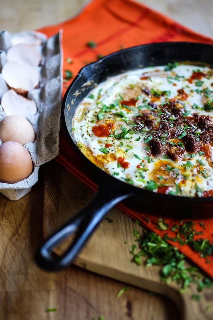 Creamy Polenta with poached eggs, chorizo and cilantro- a flavorful hearty brunch! #polenta #eggs #chorizo #brunch #breakfast #brunchrecipes #polentaeggs 