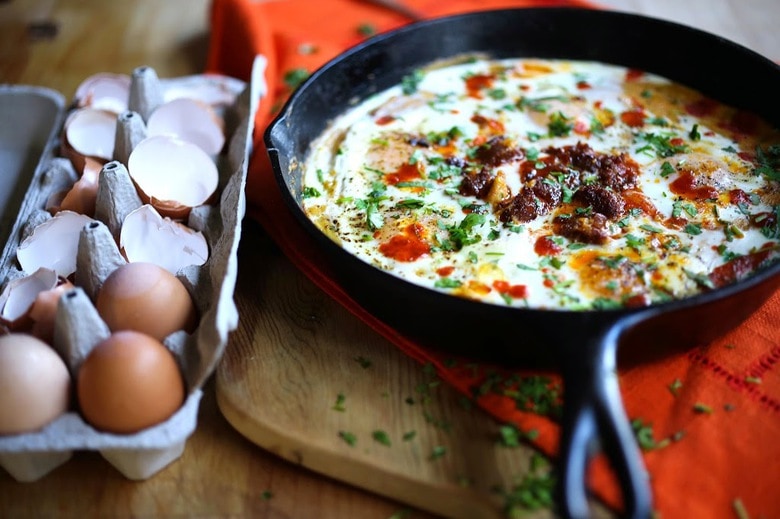 Creamy Polenta with poached eggs, spicy chorizo and cilantro- a delicious hearty brunch that is full of flavor! Feel free to use vegan chorizo or turkey chorizo! 