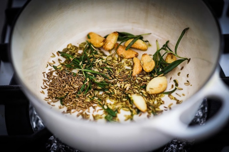 Warm olives with rosemary, garlic, and almonds - a simple, delicious appetizer that is full of amazing flavor, that can be made very quickly and easily! #warmolives #olives #marcona #almonds #rosemaryolives
