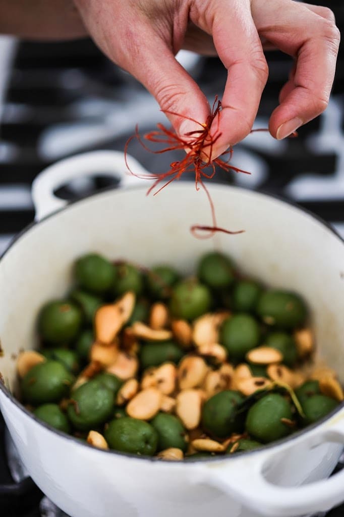  Warm olives with rosemary, garlic, and almonds - a simple, delicious appetizer that is full of amazing flavor, that can be made very quickly and easily! #warmolives #olives #marcona #almonds #rosemaryolives 