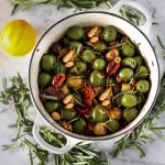 Warm olives with rosemary, garlic, and almonds - a simple, delicious appetizer that is full of amazing flavor, that can be made very quickly and easily! #warmolives #olives #marcona #almonds #rosemaryolives