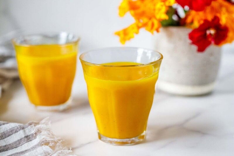 Immune-boosting, ginger turmeric shots are easy and delicious! Made with fresh turmeric root, ginger, orange, lemon, and black pepper.
