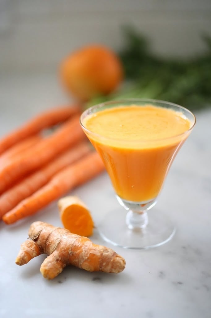Turmeric Tonic - A  healthy juice made with healing turmeric root, beets, apple, ginger and carrots to help heal the body, fight inflammation, sooth and energize. | www.feastingathome.com
